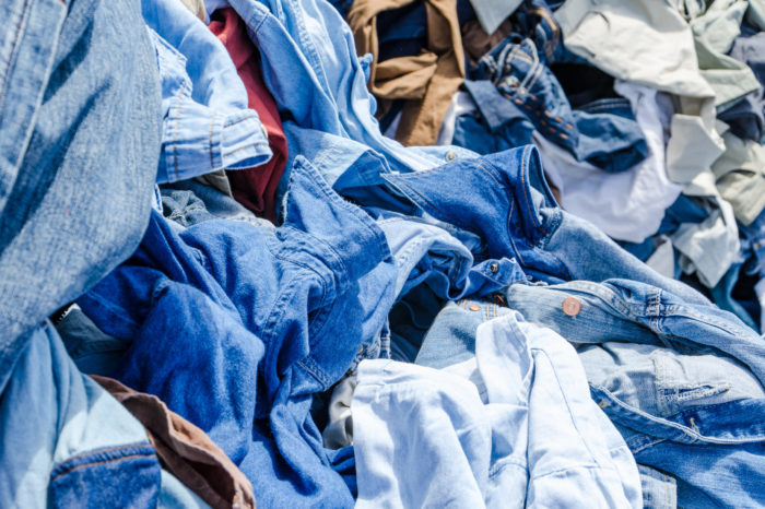 Heaps of clothing on the second hand market